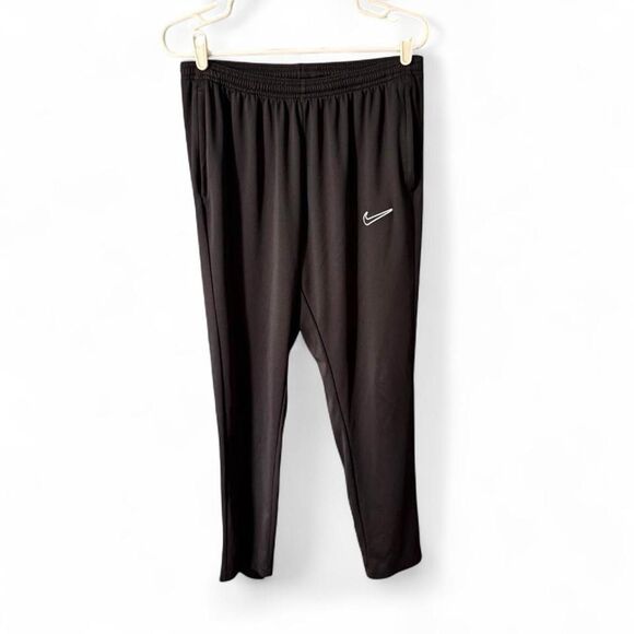 Nike Pants - Nike Women’s Dri-Fit black track pants Size M. Zippered pockets